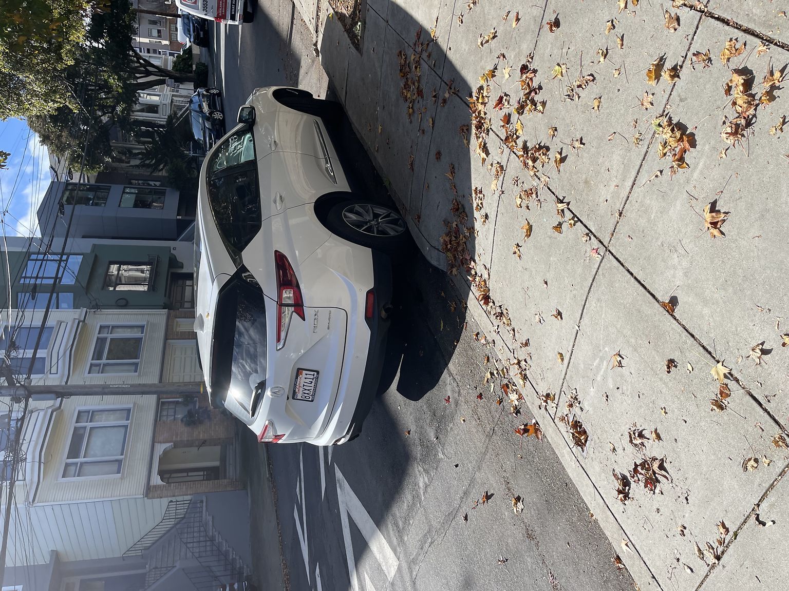 Photo of car in the street with license plate 8XXT411 in California