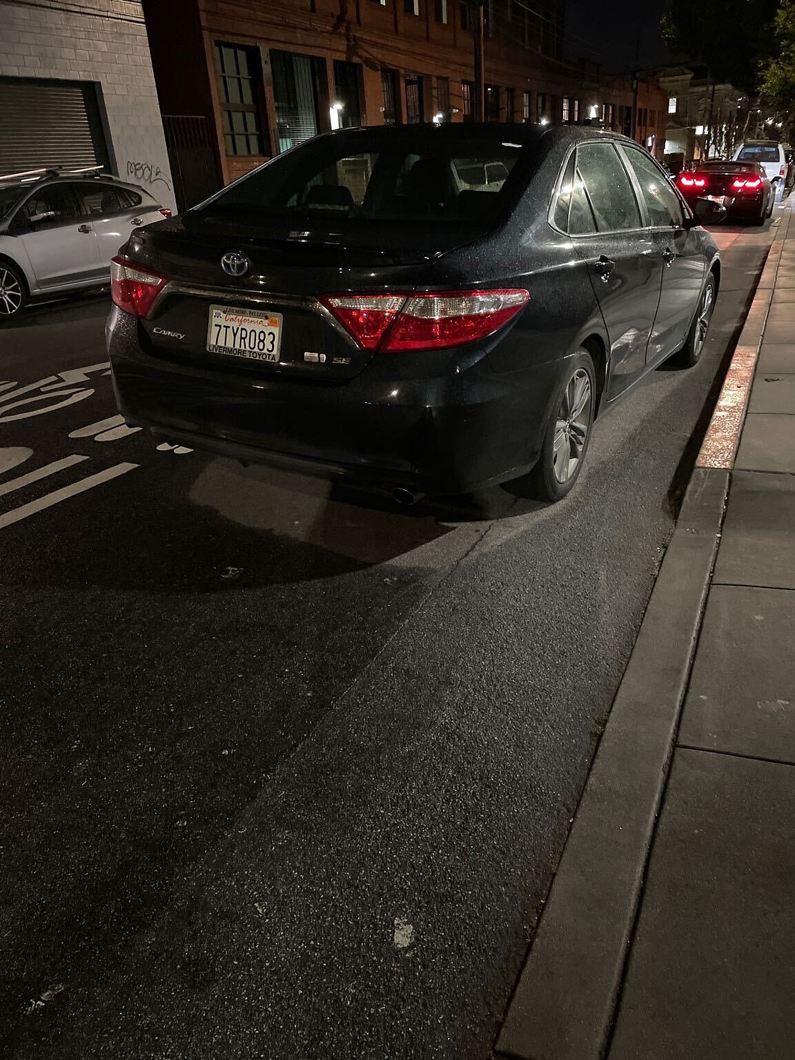 Photo of car in the street with license plate 7TYR083 in California