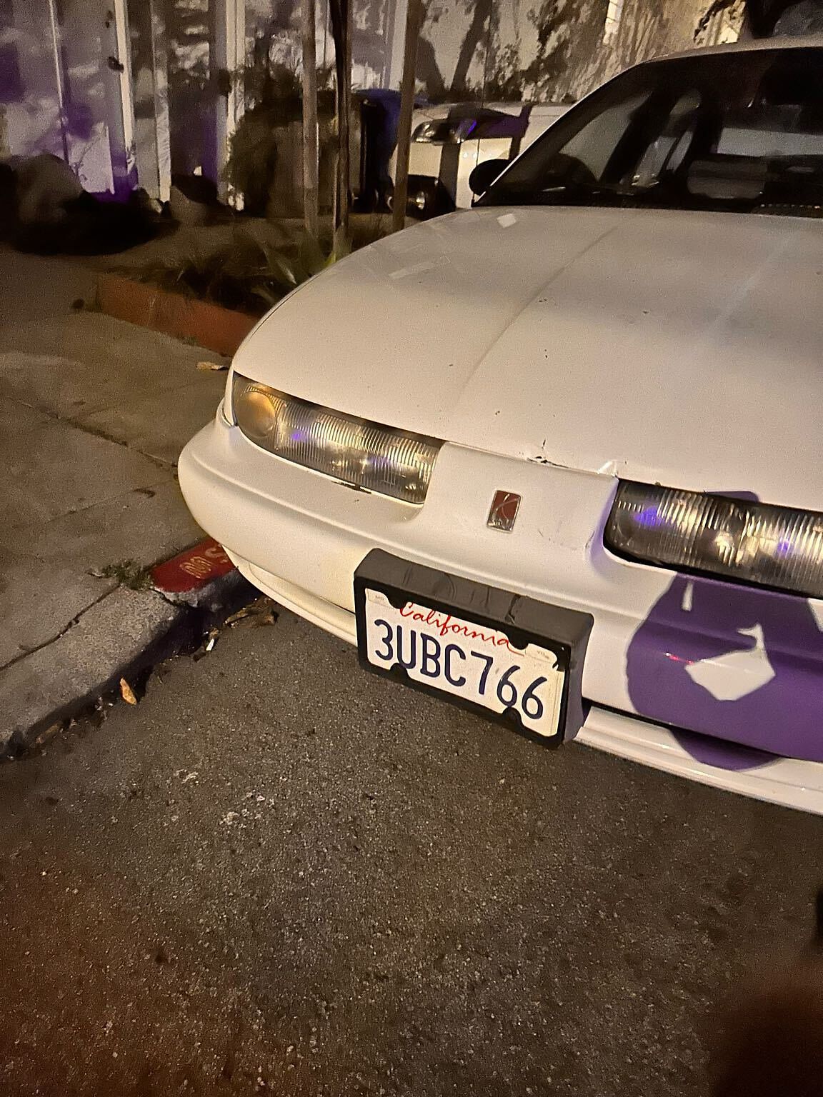 Photo of car in the street with license plate 3UBC766 in California
