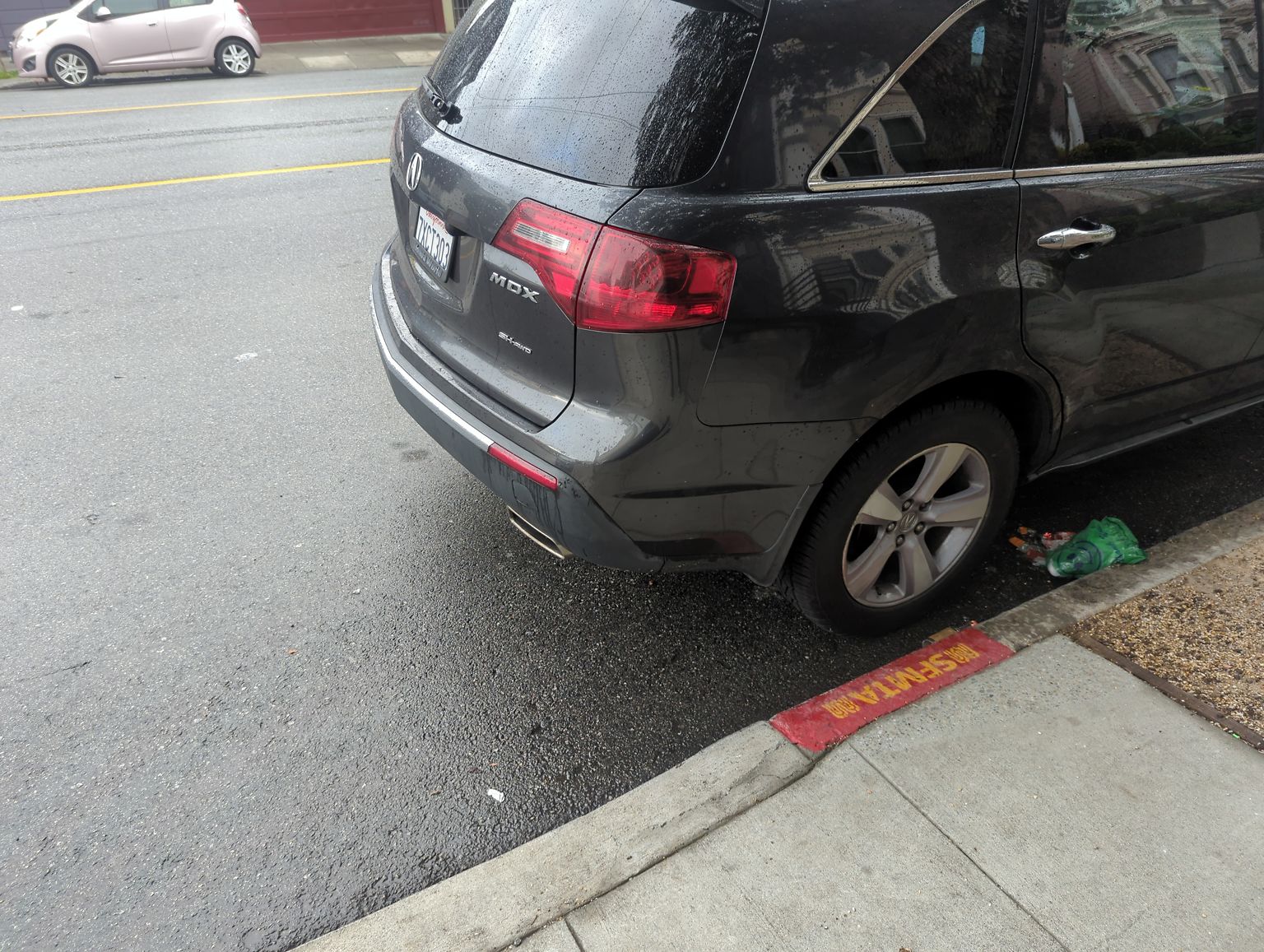 Photo of car in the street with license plate 7XCT303 in California