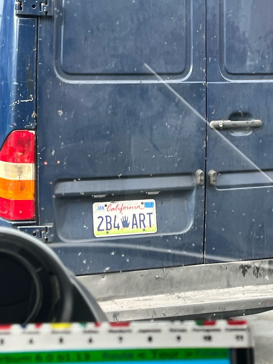 Photo of car in the street with license plate 2B4ART in California