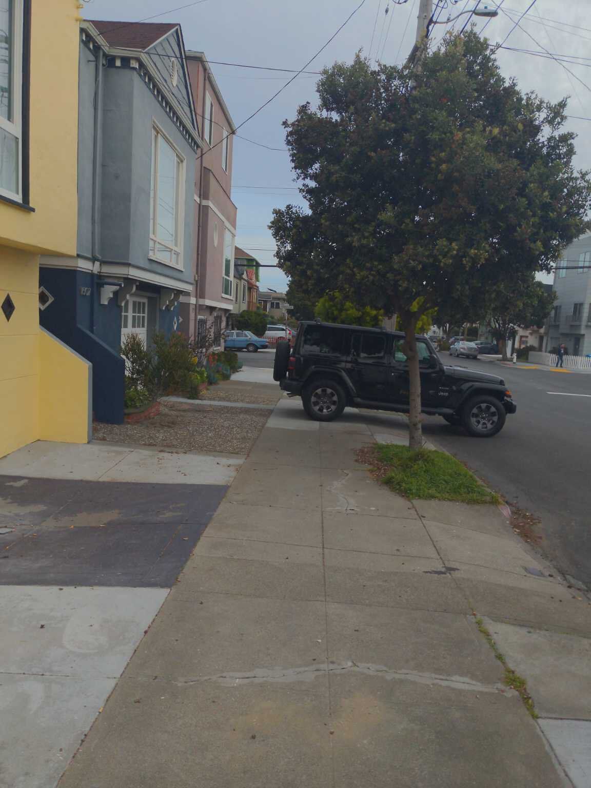 Photo of car in the street with license plate 8MIH123 in California