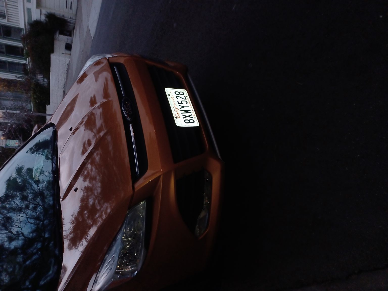 Photo of car in the street with license plate 8XWY528 in California