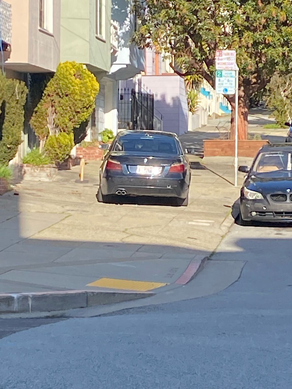 Photo of car in the street with license plate ILLEGIB in California