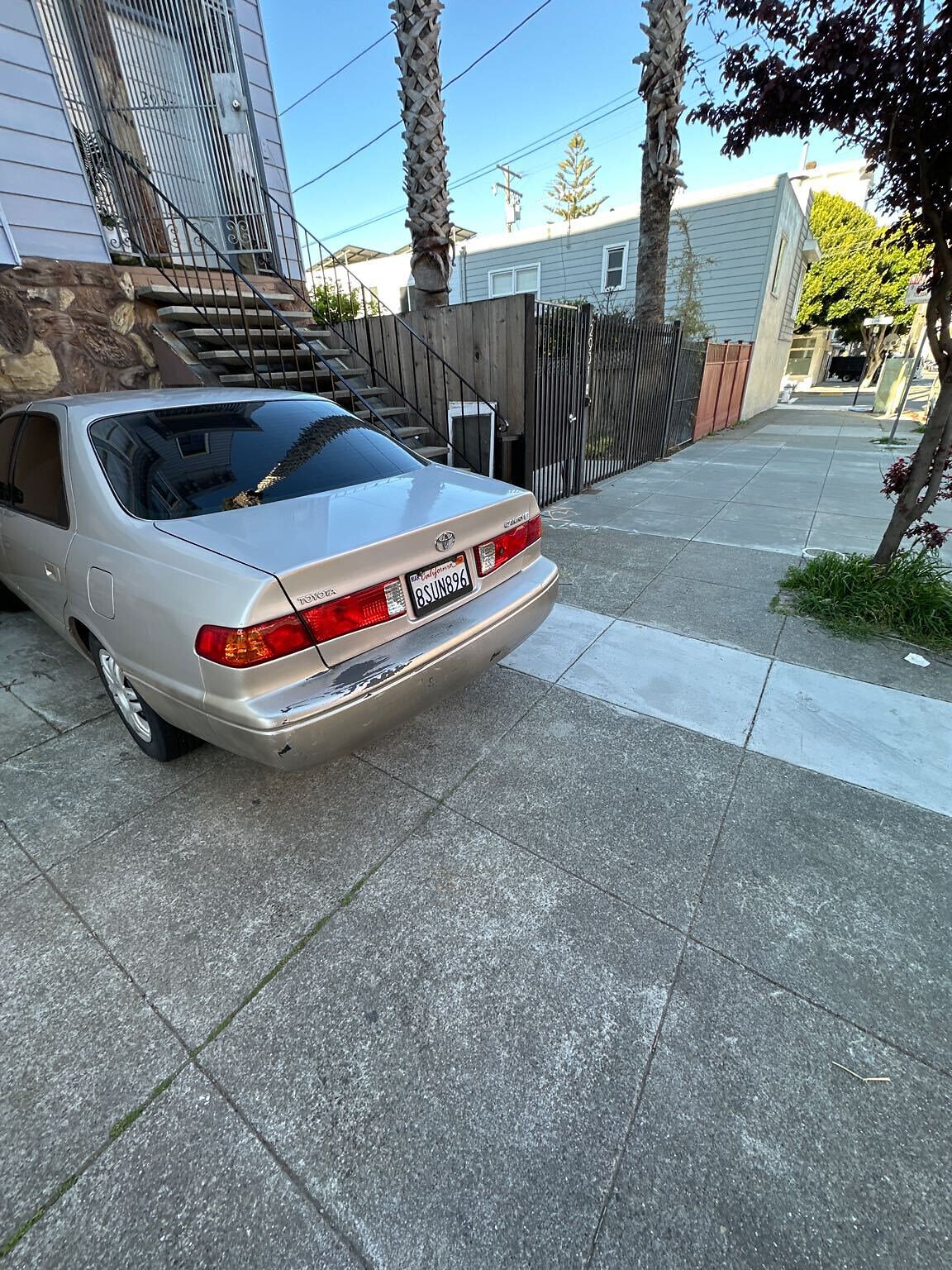 Photo of car in the street with license plate 8SUN896 in California