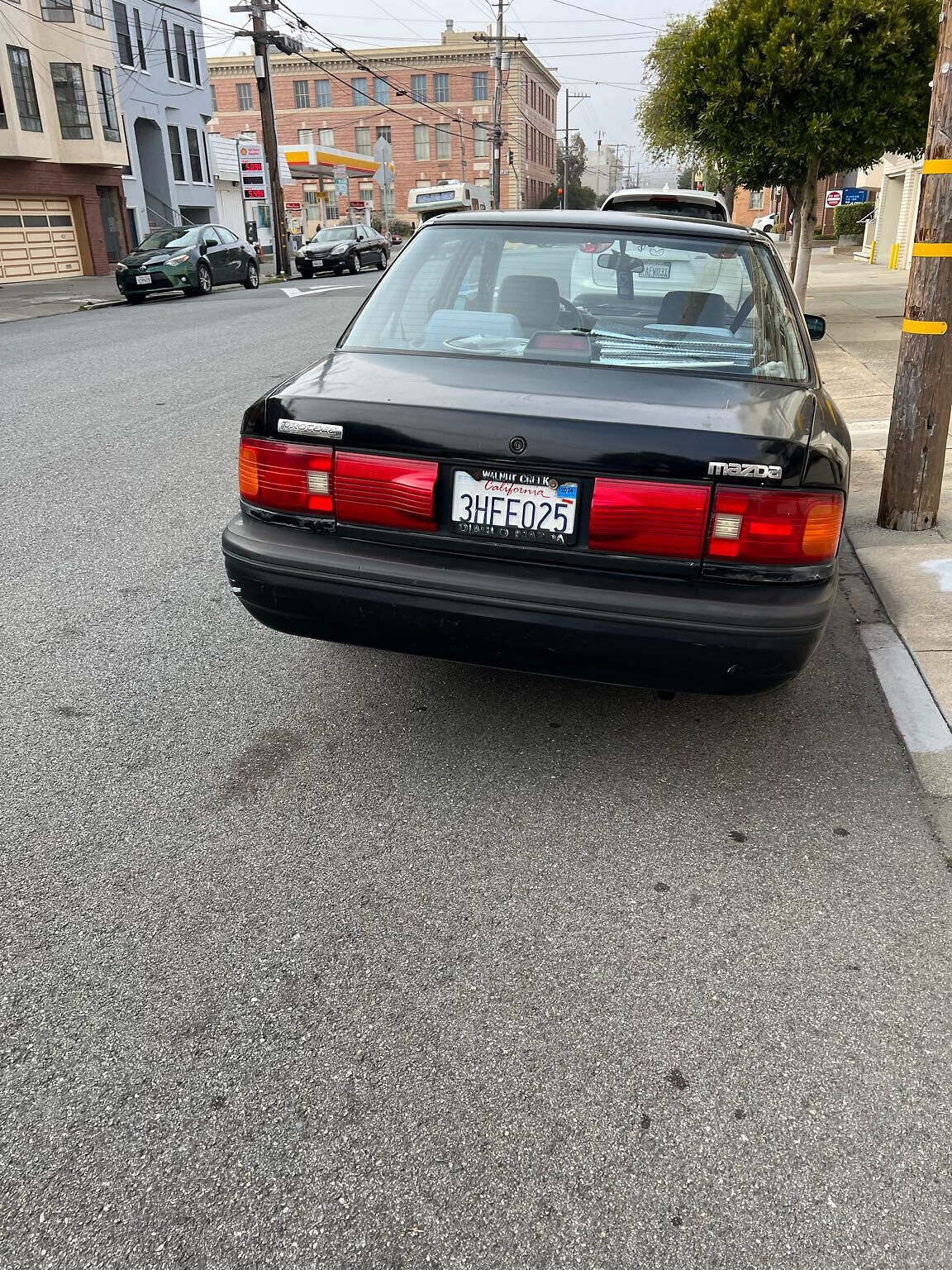 Photo of car in the street with license plate 3HFE025 in California