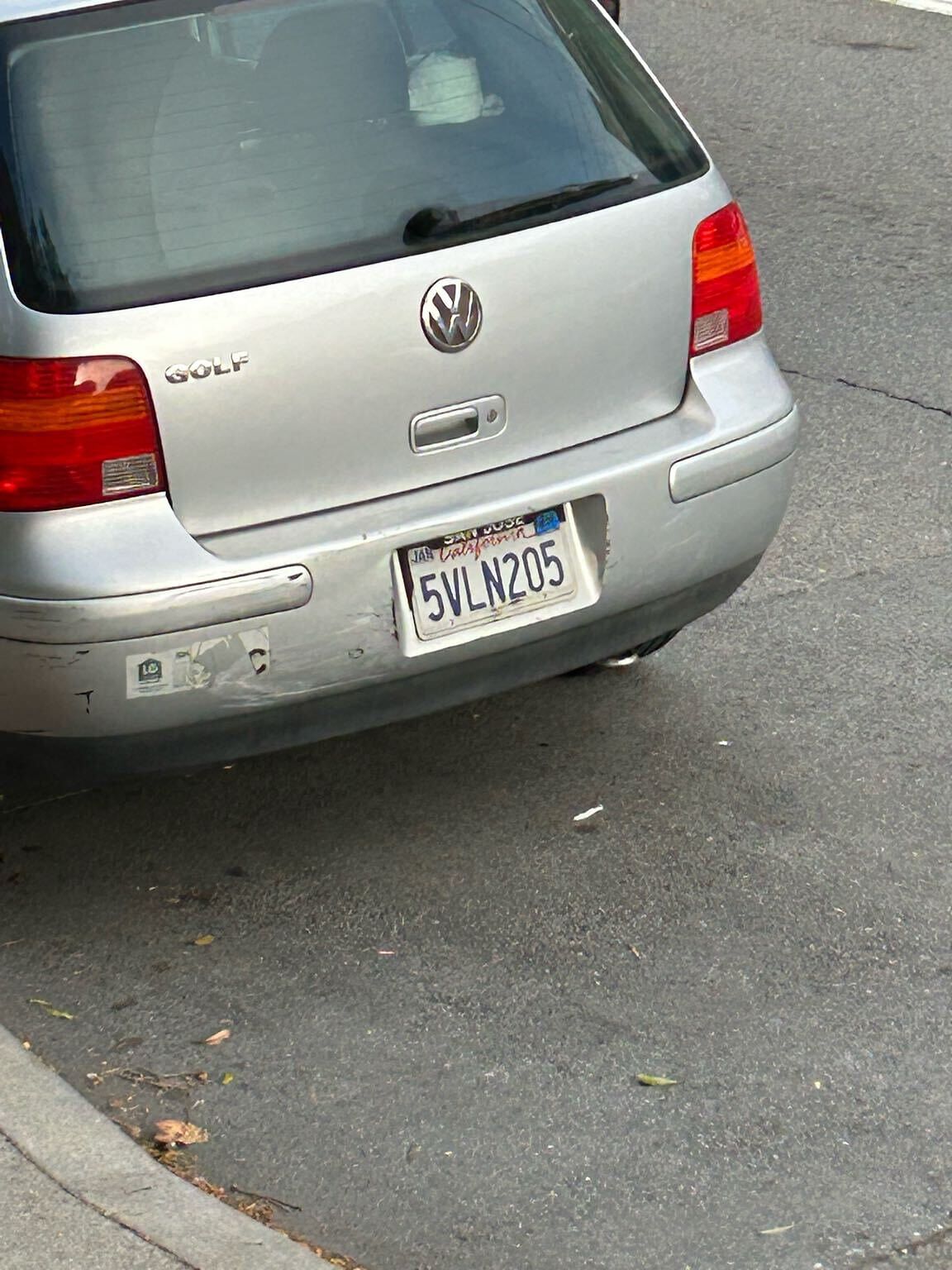Photo of car in the street with license plate 5VLN205 in California