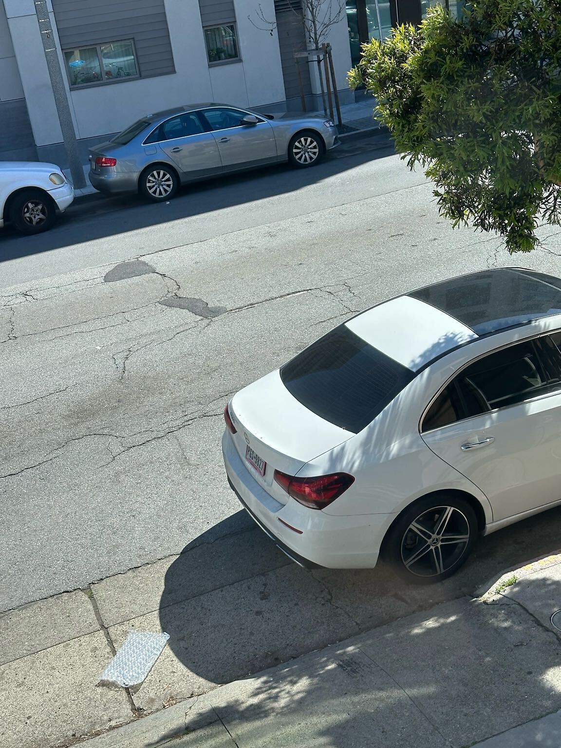 Photo of car in the street with license plate PGS9827 in California