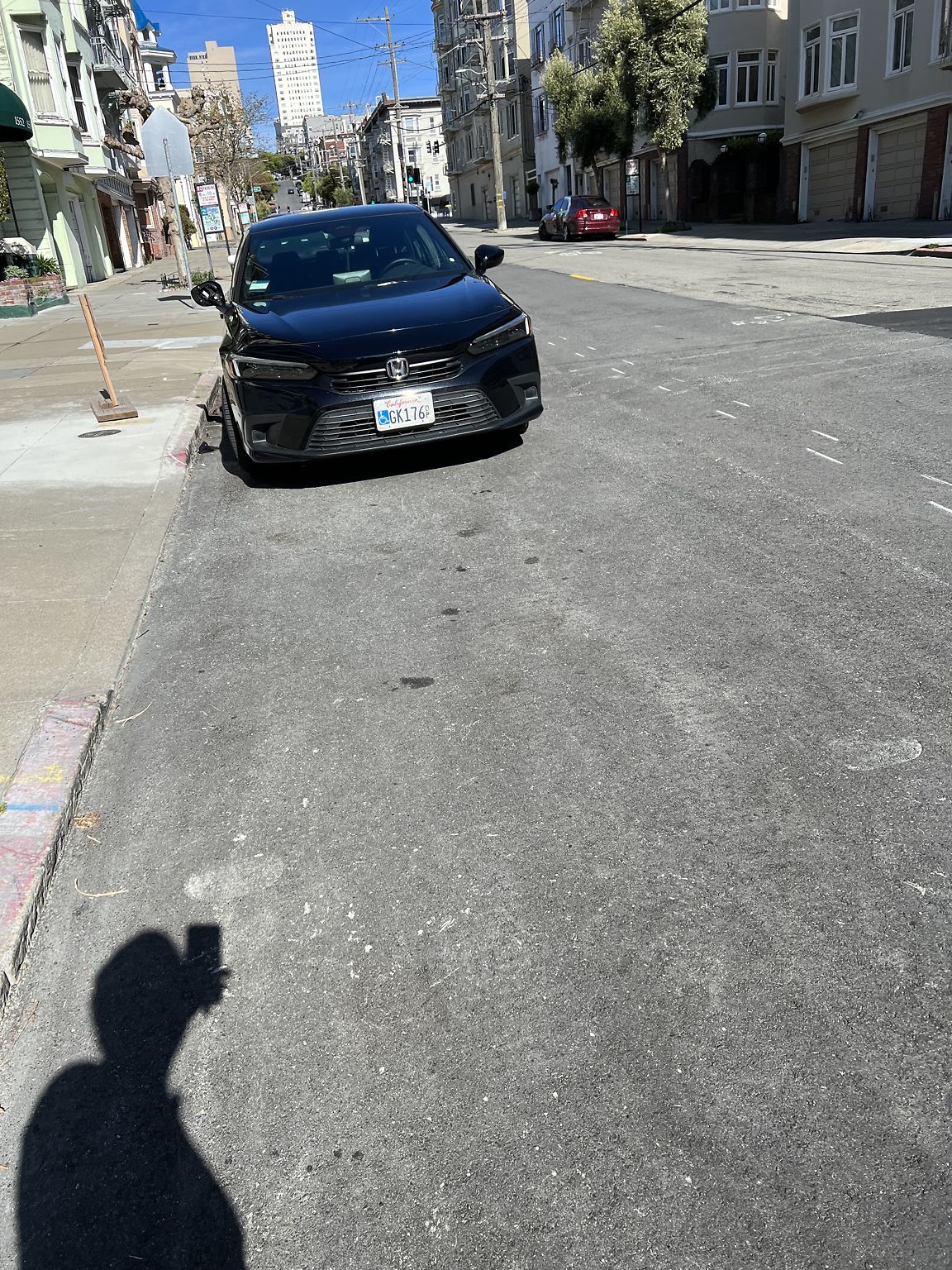 Photo of car in the street with license plate GK176 in California