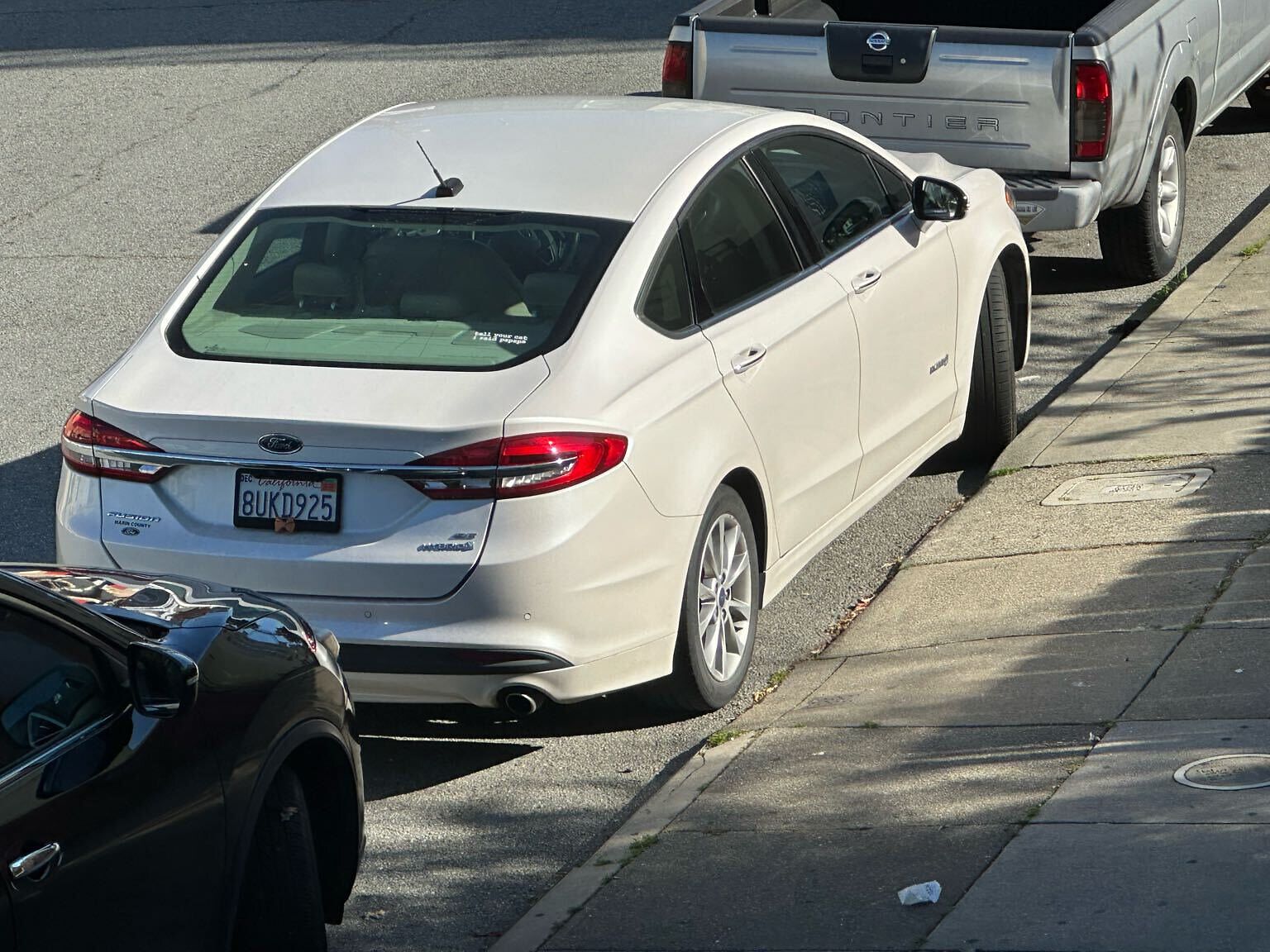 Photo of car in the street with license plate 8UKD925 in California